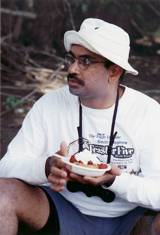 Rajesh enjoying dessert. (Category:  Paddling)