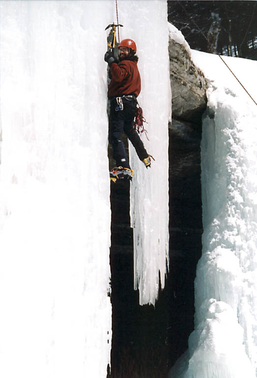 Rich transitioning from one icicle to another. (Category:  Ice Climbing)