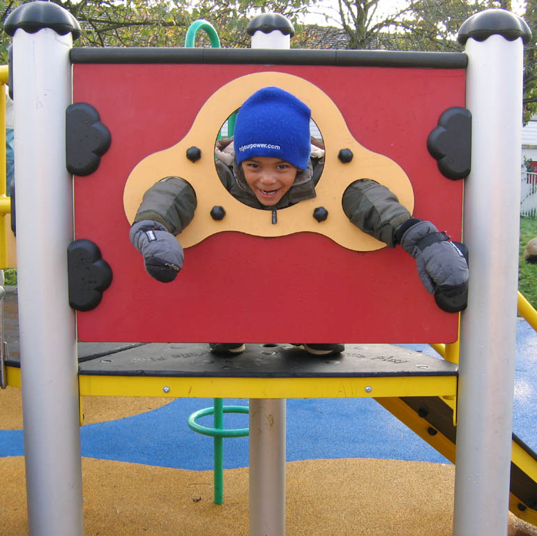 Nassor enjoying a playground. (Category:  Travel)