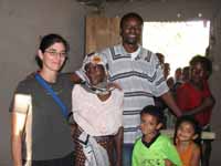 Rachel, Hussein, Nassor and Sophia visiting another home. (Category:  Travel)