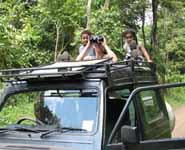 Nassor, Rachel and Sophia looking out the sunroof of our Suzuki Samurai. (Category:  Travel)