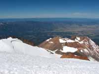 View east from near the summit of Mt. Shasta.  On the left is the bergschrund for what I believe is the Whitney glacier. (Category:  Rock Climbing)