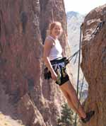 Caroline at the top of Rope De Dope block. (Category:  Rock Climbing)