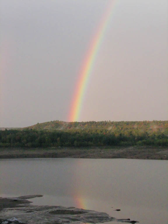 Driving home I saw the brightest rainbow I've ever seen in my life.  It was bright enough to reflect off the lake. (Category:  Family)
