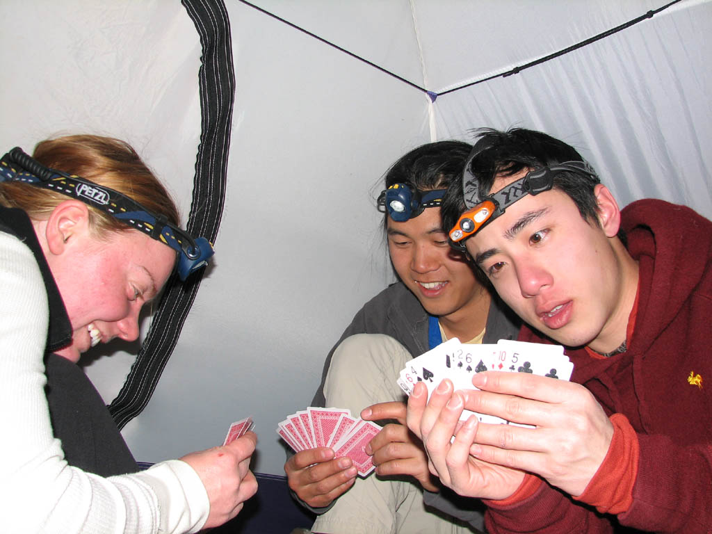 Kristin, Aramy and Kenny playing cards in my tent. (Category:  Rock Climbing)