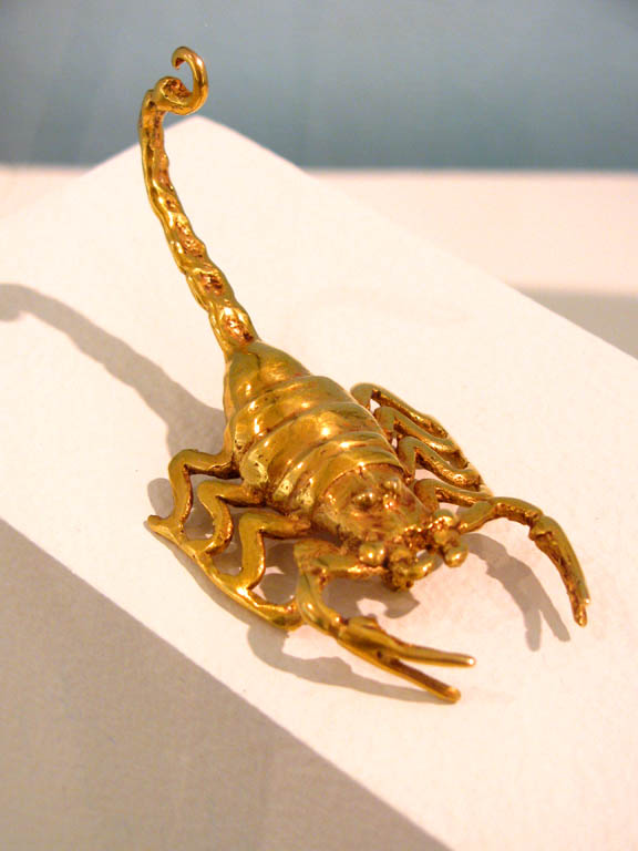 Gold scorpion. (Category:  Travel)
