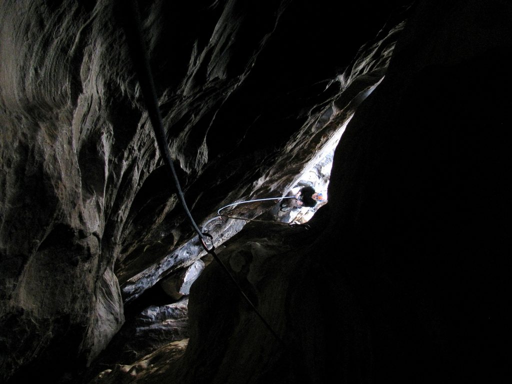 Looking down the tunnel on Tunnel Vision at Zoe belaying below. (Category:  Rock Climbing)
