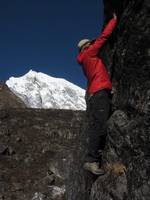 Josh bouldering with Langtang Lirung in the background. (Category:  Travel)