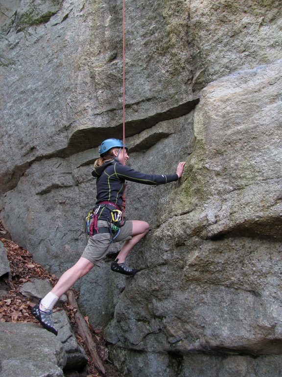 Beth doing the flying squirrel at the start of Wegetables. (Category:  Rock Climbing)