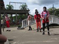 Street performers in the San Isidro central park. (Category:  Travel)