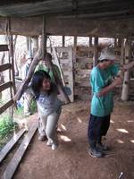 Becky grinding sugar cane. (Category:  Travel)
