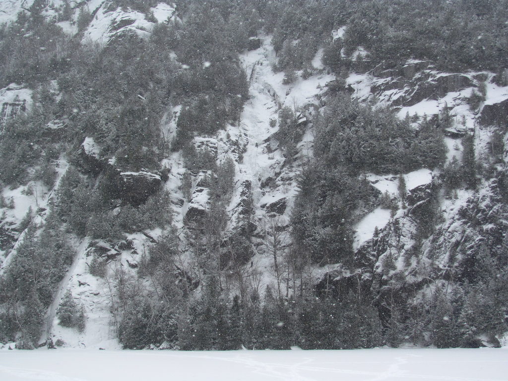 Tammy leading the first pitch of Chouinard's Gully in the middle of a winter storm. (Category:  Ice Climbing)