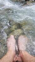 Soaking my sore feet in the frigid river (Category:  Climbing)