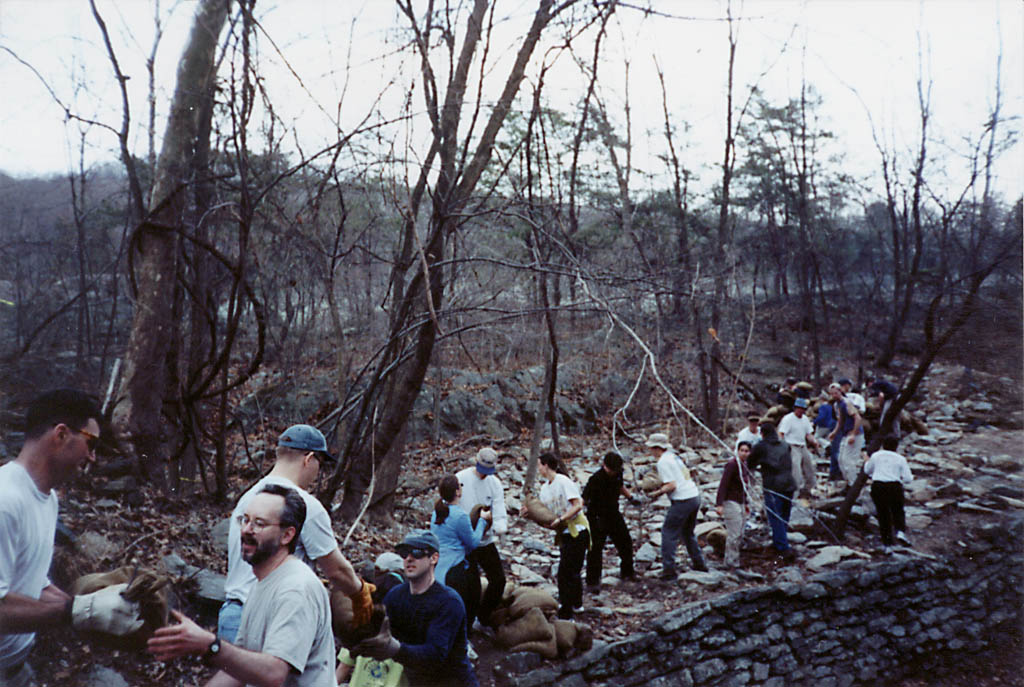 Volunteers moving sand bags. (Category:  Rock Climbing)