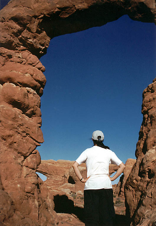 Lauren under an arch. (Category:  Rock Climbing)