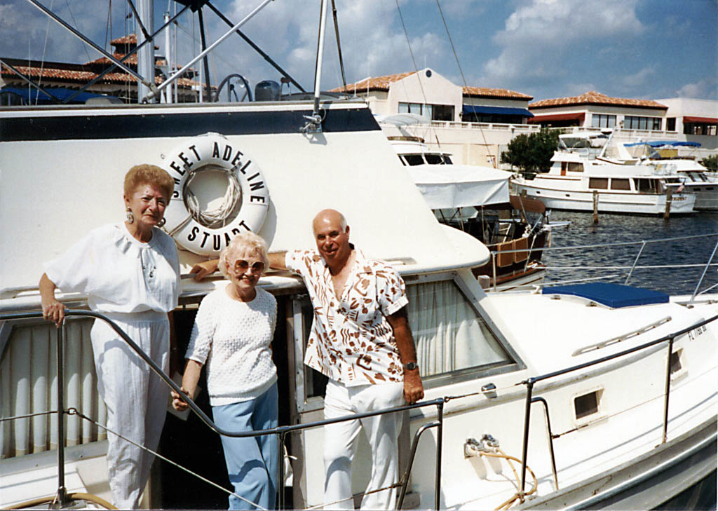 Grandma, a friend, and Grandpa out on their boat, Sweet Adeline. (Category:  Family)