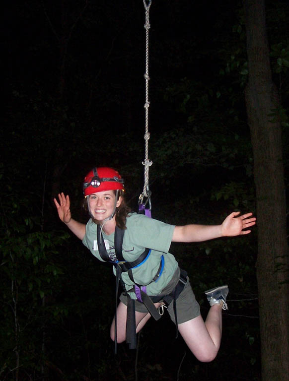 Jessica on the zip line at night. (Category:  Ropes Course Climbing)