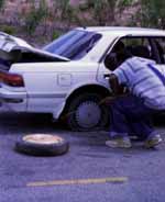 Fixing a flat tire. (Category:  Travel)