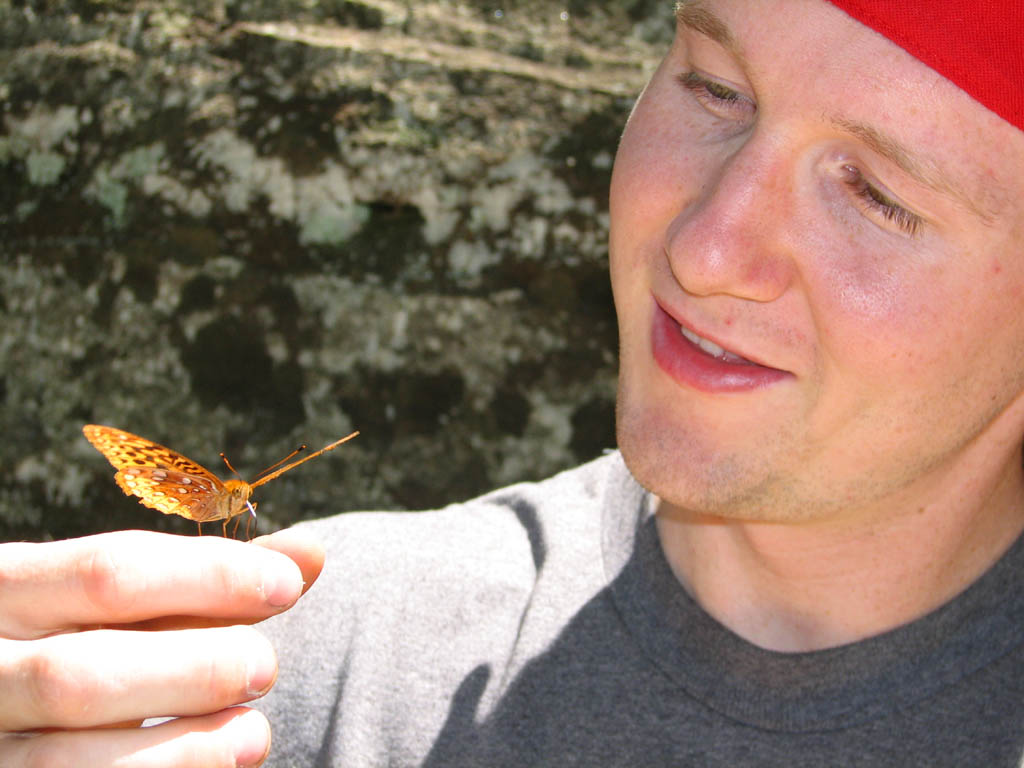 Ryan with a very friendly butterfly. (Category:  Rock Climbing)