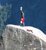 Ryan doing a handstand on top of Lost Arrow Spire. (Category:  Rock Climbing)