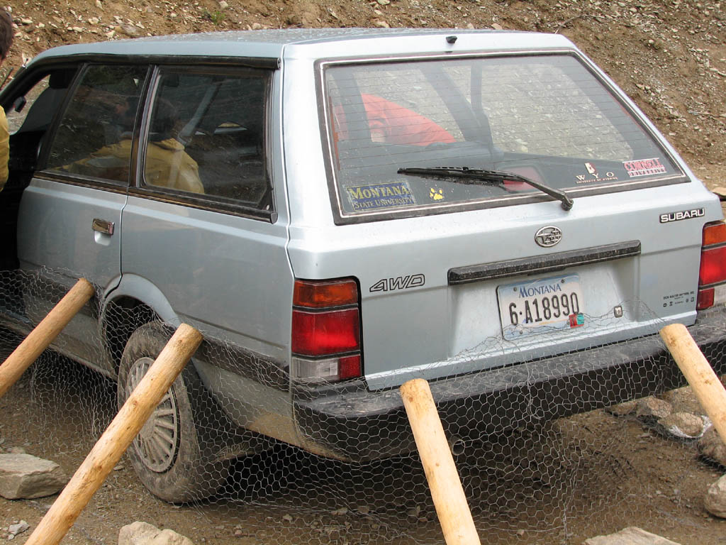Brian's car surrounded by chicken wire. (Category:  Rock Climbing)