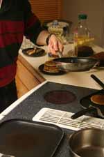Pancake flipping. (Category:  Party)