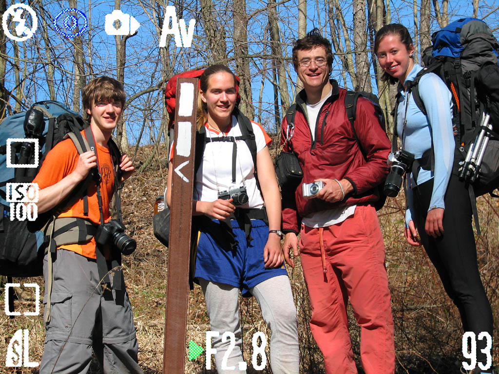 Floris, Julia, me and Heather posing by a Finger Lakes Trail marker.  I created this image with Photoshop to make it look like a camera's viewfinder. (Category:  Backpacking)