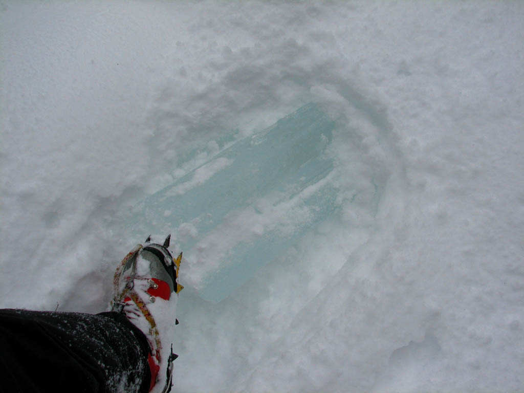 Keith with his foot on one of the blocks of ice that nearly killed him. (Category:  Ice Climbing)