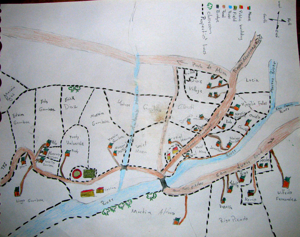 Rolando draws us a map of Tres Piedras. (Category:  Travel)