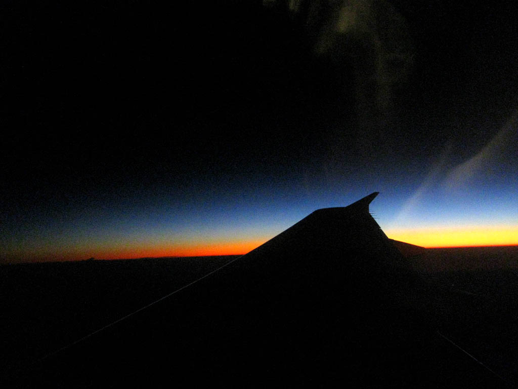Sunset viewed out the airplane window as we approach San Jose. (Category:  Travel)