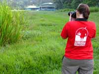 Jess taking a picture of the Sirena Ranger Station. (Category:  Travel)