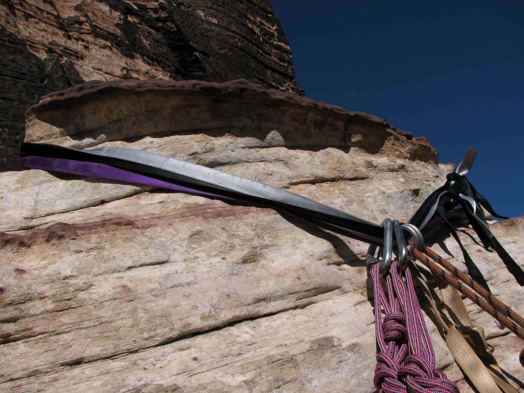 Slings around a pillar. Bomber anchor as long as there is no upward pull. (Category:  Rock Climbing)
