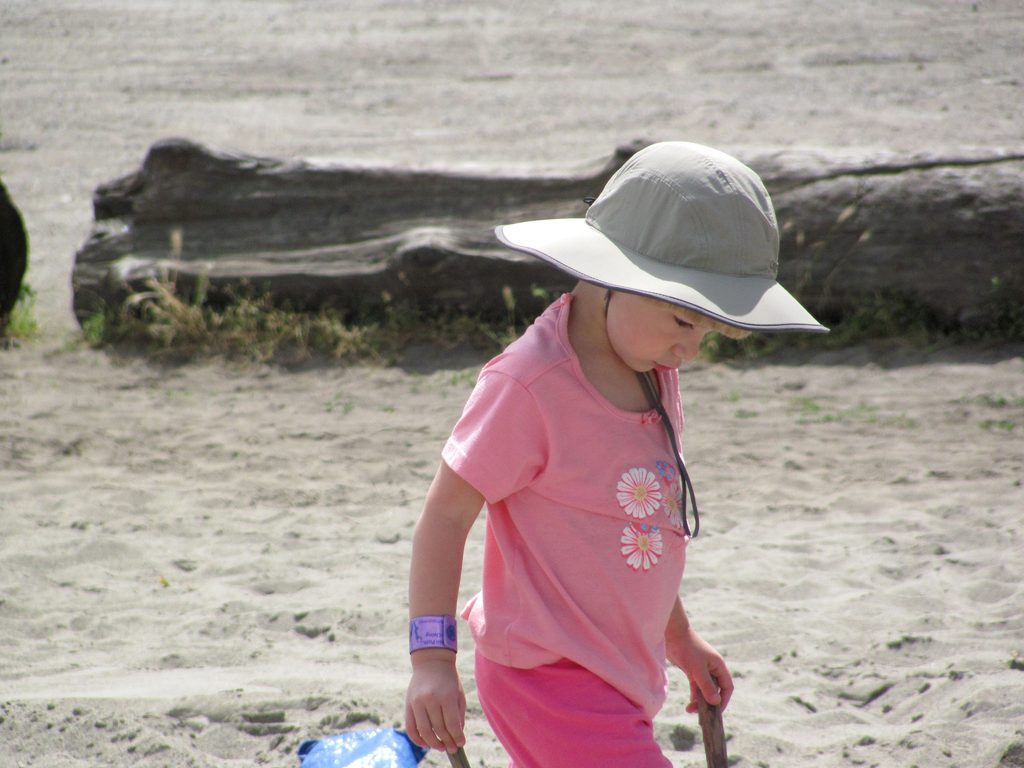 Joelle intently looking for just the right sand to put in her socks. (Category:  Rock Climbing, Tree Climbing)