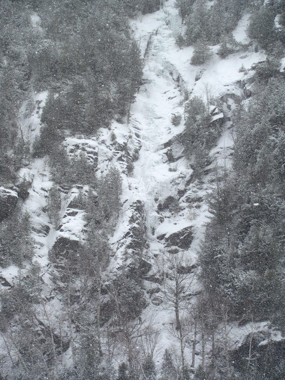 Tammy leading the first pitch of Chouinard's Gully in the middle of a winter storm. (Category:  Ice Climbing)