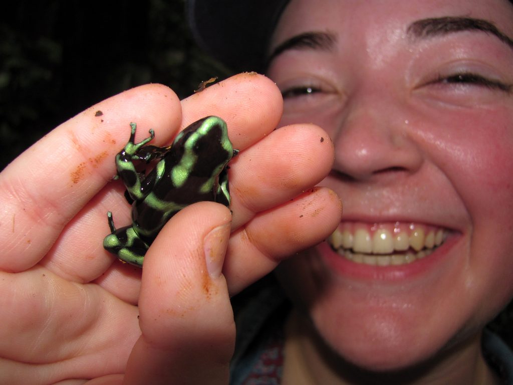 Tara holding a Black and Green Dart Frog. (Category:  Photography)