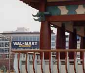A traditional Korean pavilion with a Wal-Mart Supercenter in the background. (Category:  Photography)